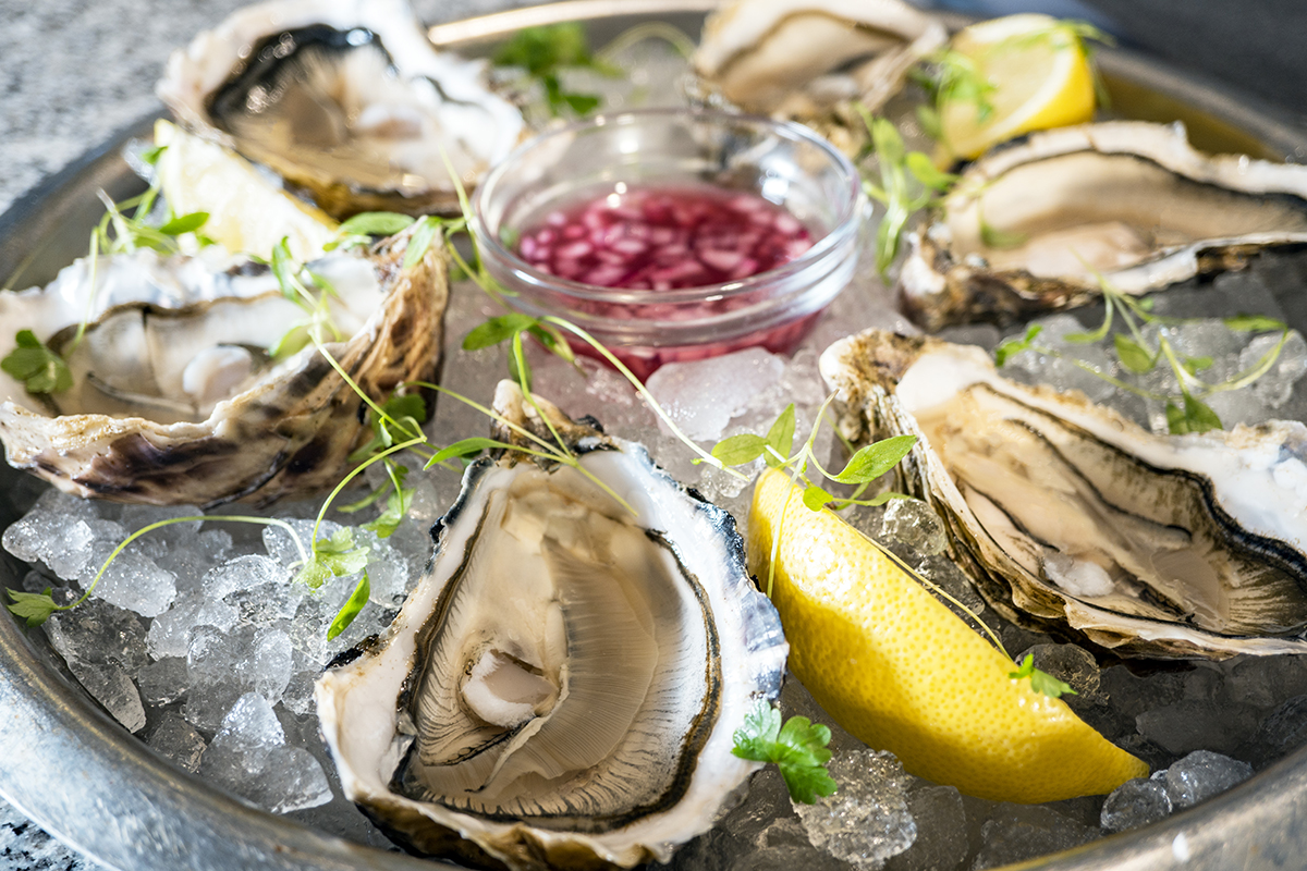 Loch Fyne Oysters - platter on ice with shallot vinegar and lemon